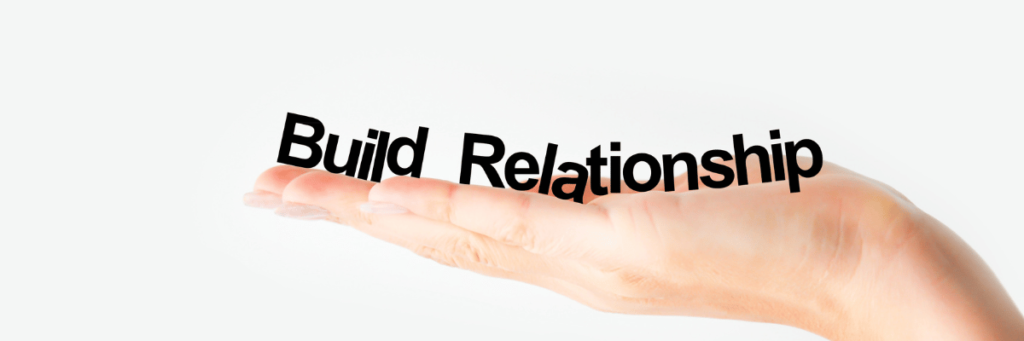 Build relationship word lying on a hand
